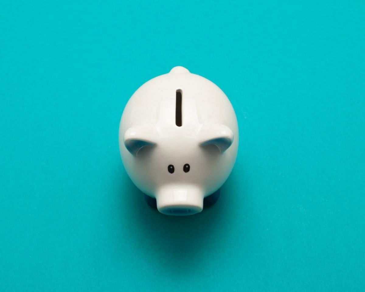 White piggy bank on a blue background